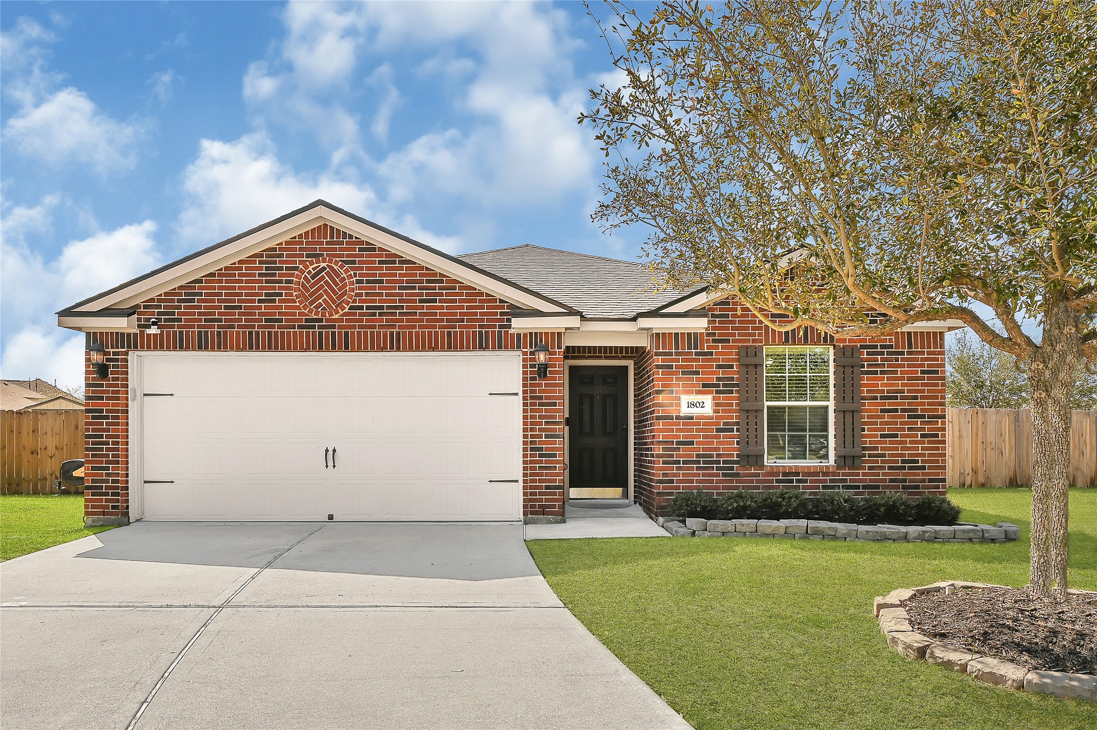 1802 Opal Peach Drive Rosharon, TX 77583 - Photo 31 of 35 front view of a house with a yard