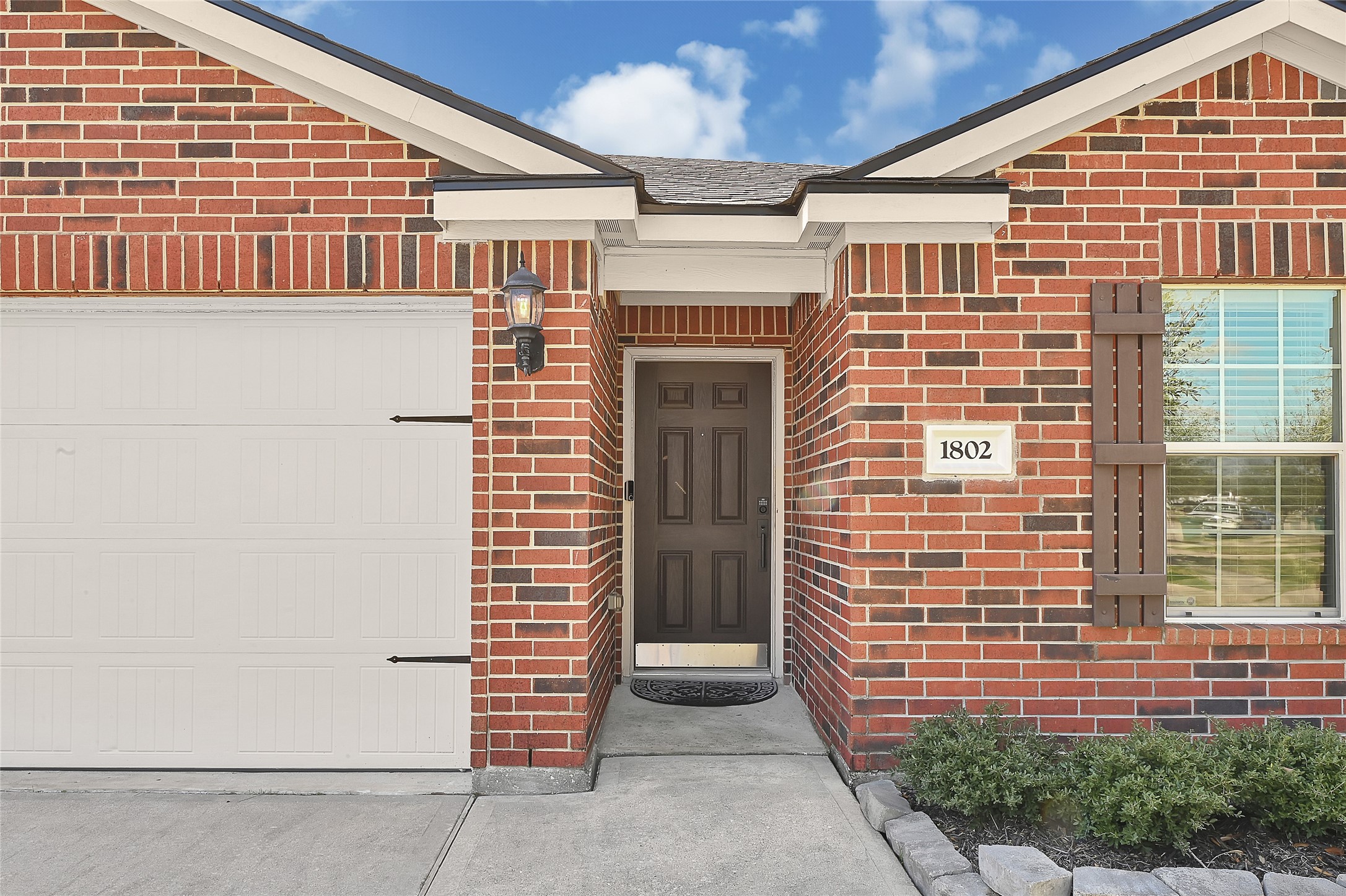 1802 Opal Peach Drive Rosharon, TX 77583 - Photo 33 of 35 a front view of a house with a yard