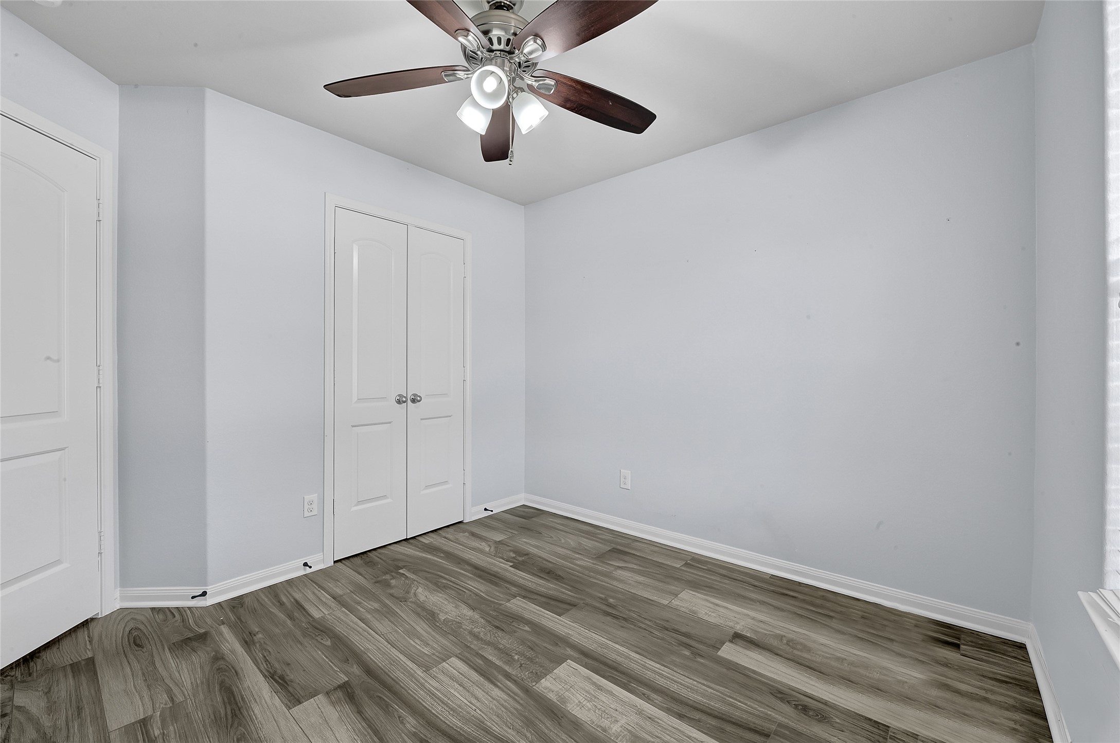 1802 Opal Peach Drive Rosharon, TX 77583 - Photo 5 of 35 a view of empty room with wooden floor