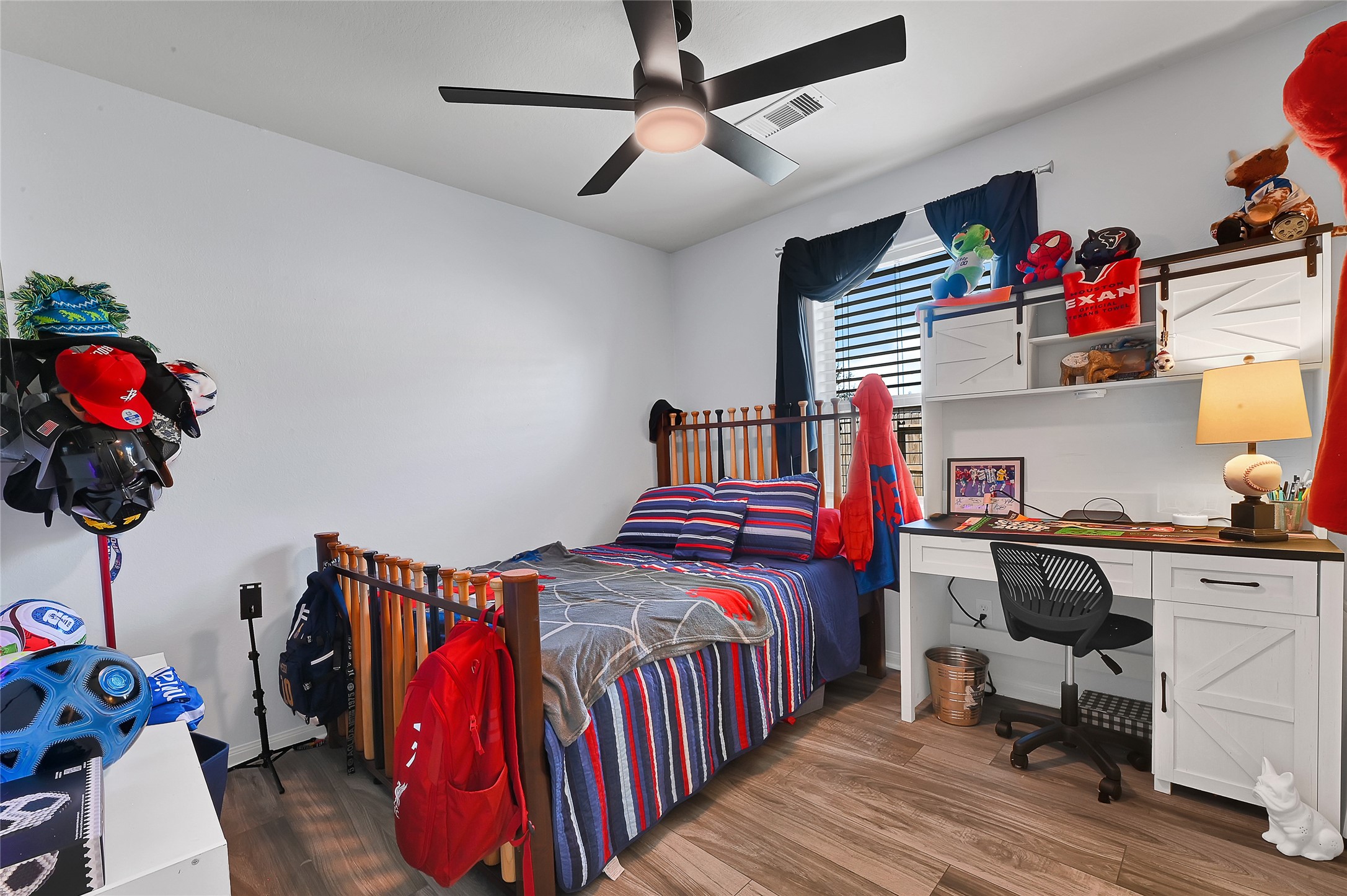 1802 Opal Peach Drive Rosharon, TX 77583 - Photo 7 of 35 a bedroom with a bed and wooden floor