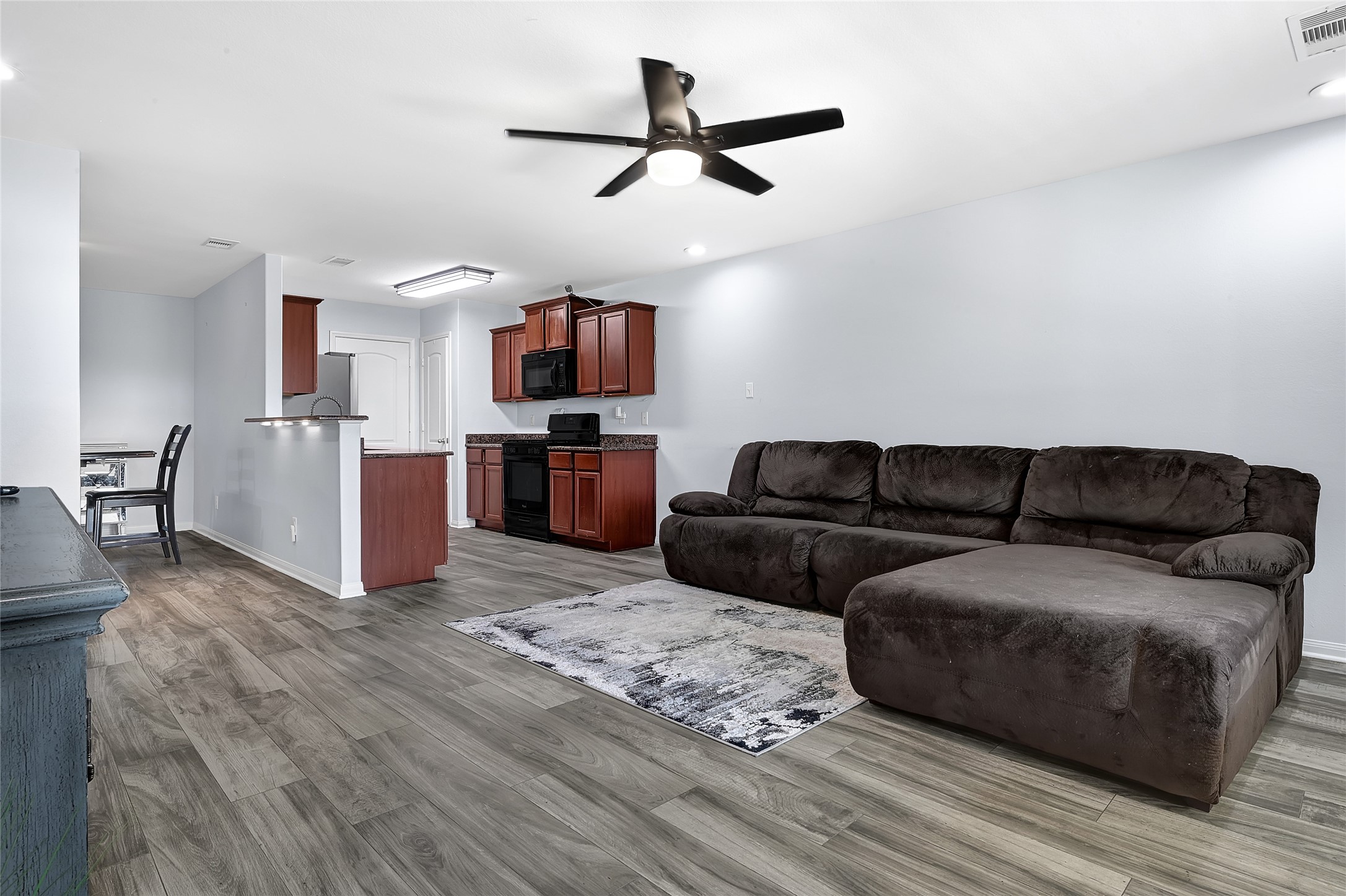 1802 Opal Peach Drive Rosharon, TX 77583 - Photo 10 of 35 a living room with furniture and a flat screen tv