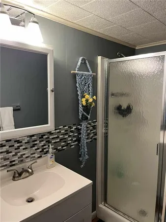 a bathroom with a sink and mirror