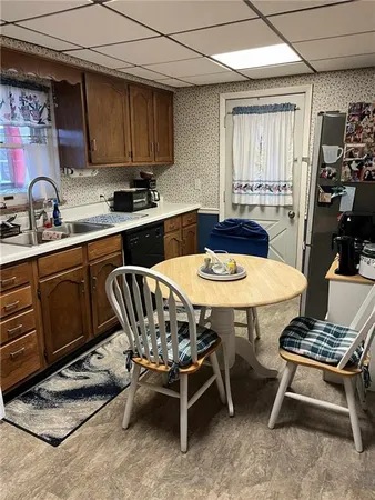 a kitchen with a table chairs and a stove