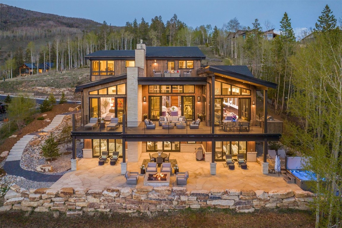 aerial view of a house with a yard balcony