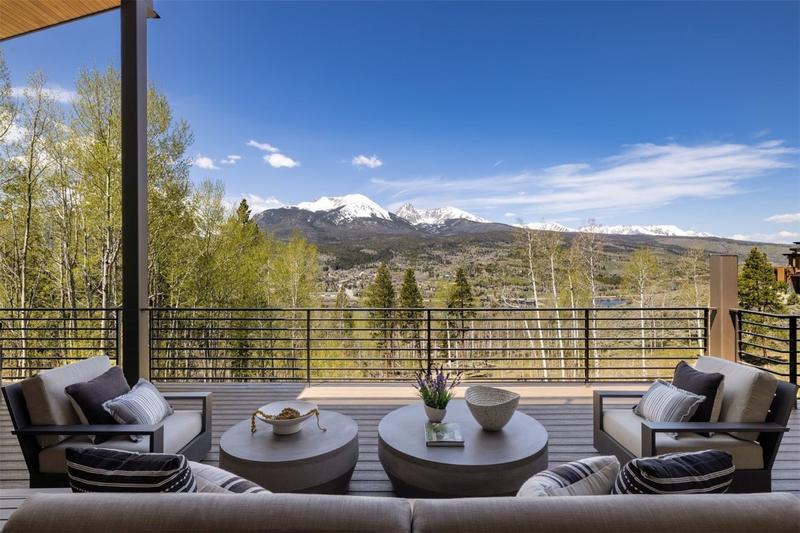 194 Angler Mountain Ranch Road Silverthorne, CO 80498 - Photo 18 of 50 a view of a patio with couches chairs and wooden floor