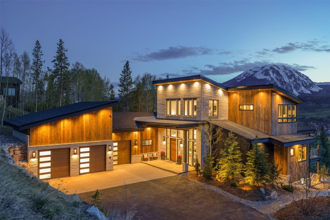 194 Angler Mountain Ranch Road Silverthorne, CO 80498 - Photo 2 of 50 a view of a brick house with a large windows