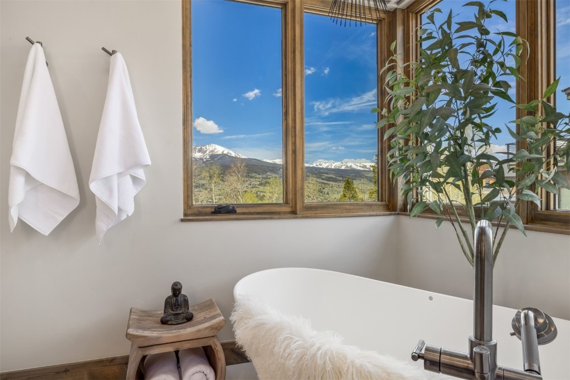 194 Angler Mountain Ranch Road Silverthorne, CO 80498 - Photo 23 of 50 a white bath tub sitting next to a window