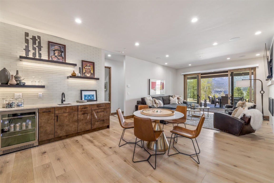 194 Angler Mountain Ranch Road Silverthorne, CO 80498 - Photo 35 of 50 a view of a dining room with furniture window and wooden floor