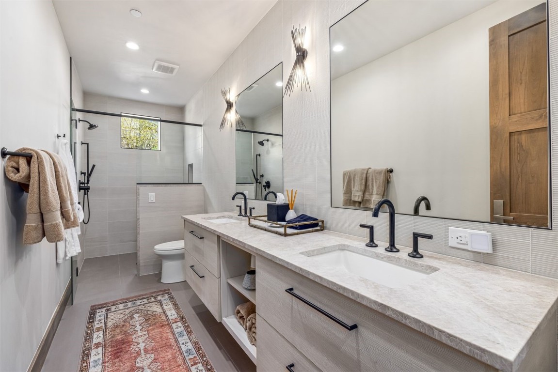 194 Angler Mountain Ranch Road Silverthorne, CO 80498 - Photo 39 of 50 a bathroom with a sink double vanity and a toilet