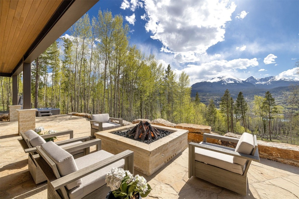 194 Angler Mountain Ranch Road Silverthorne, CO 80498 - Photo 44 of 50 a view of a patio with couches table and chairs and potted plants