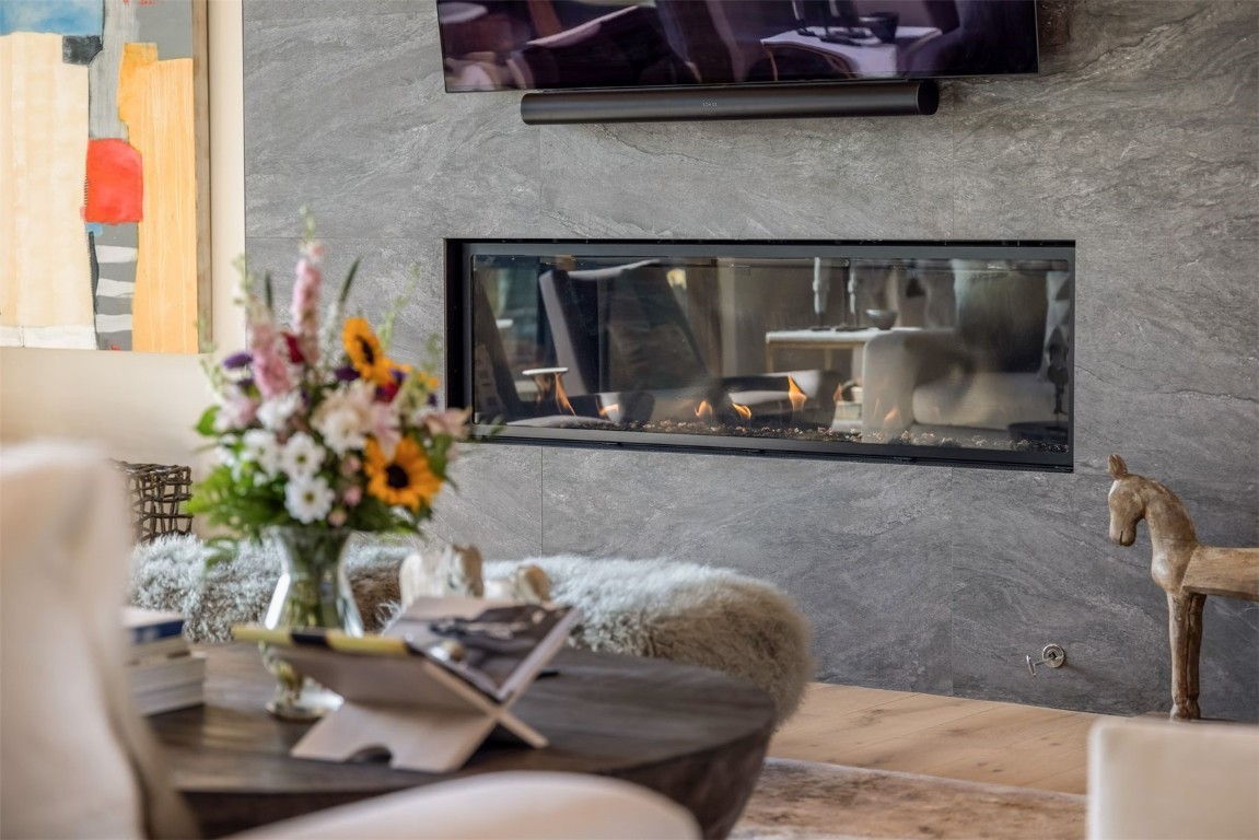 194 Angler Mountain Ranch Road Silverthorne, CO 80498 - Photo 7 of 50 a living room with furniture and a fireplace