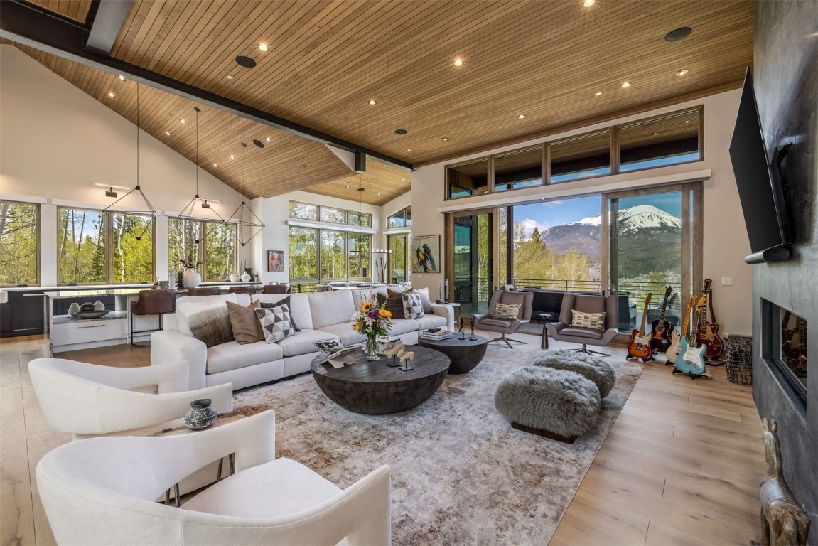 194 Angler Mountain Ranch Road Silverthorne, CO 80498 - Photo 8 of 50 a living room with furniture fireplace and a large window