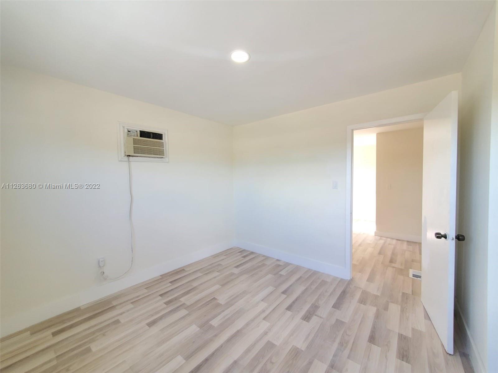 291 West 41st Street Hialeah, FL 33012 - Photo 27 of 40 wooden floor in an empty room