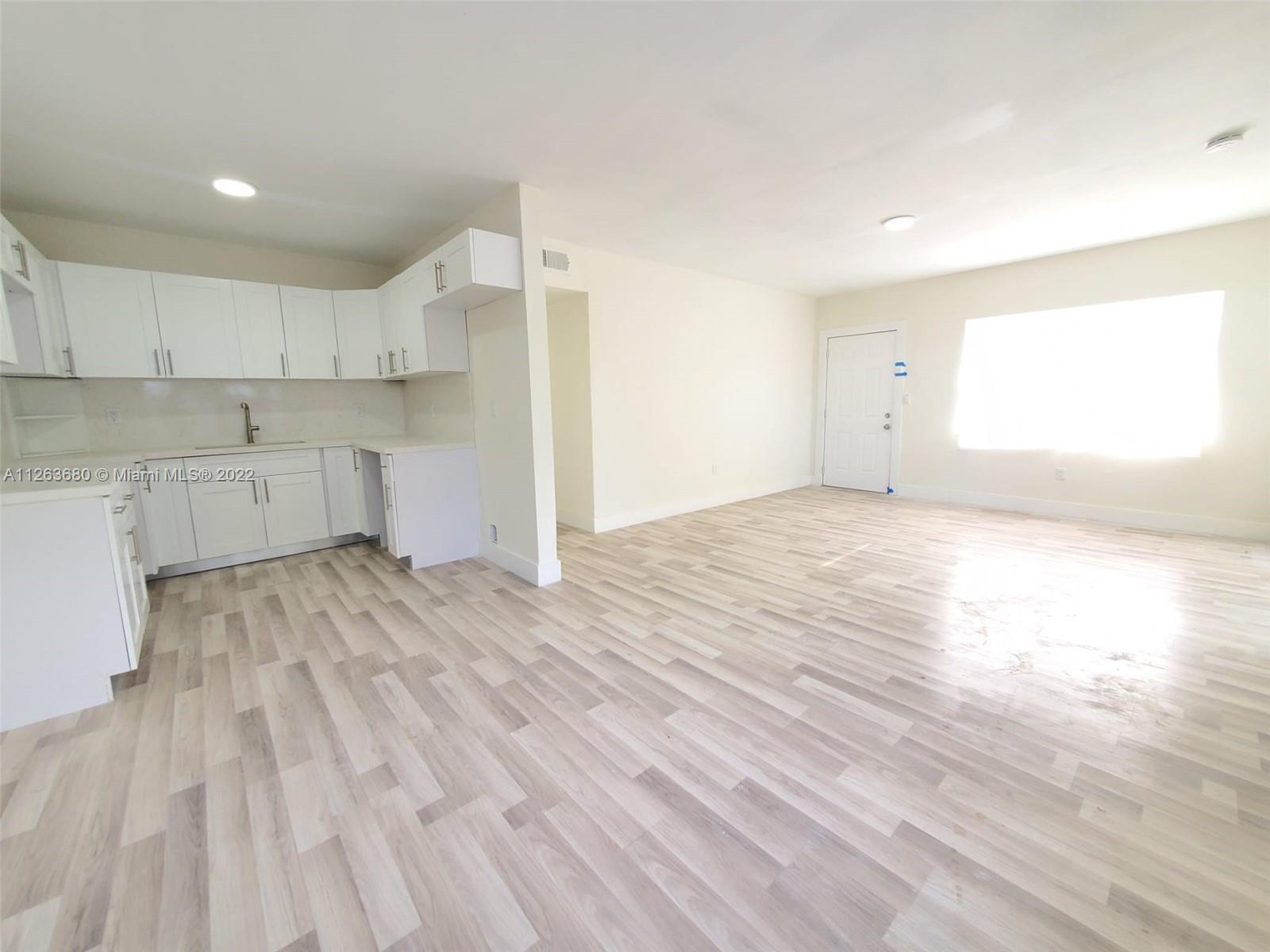 291 West 41st Street Hialeah, FL 33012 - Photo 4 of 40 a view of kitchen and wooden floor