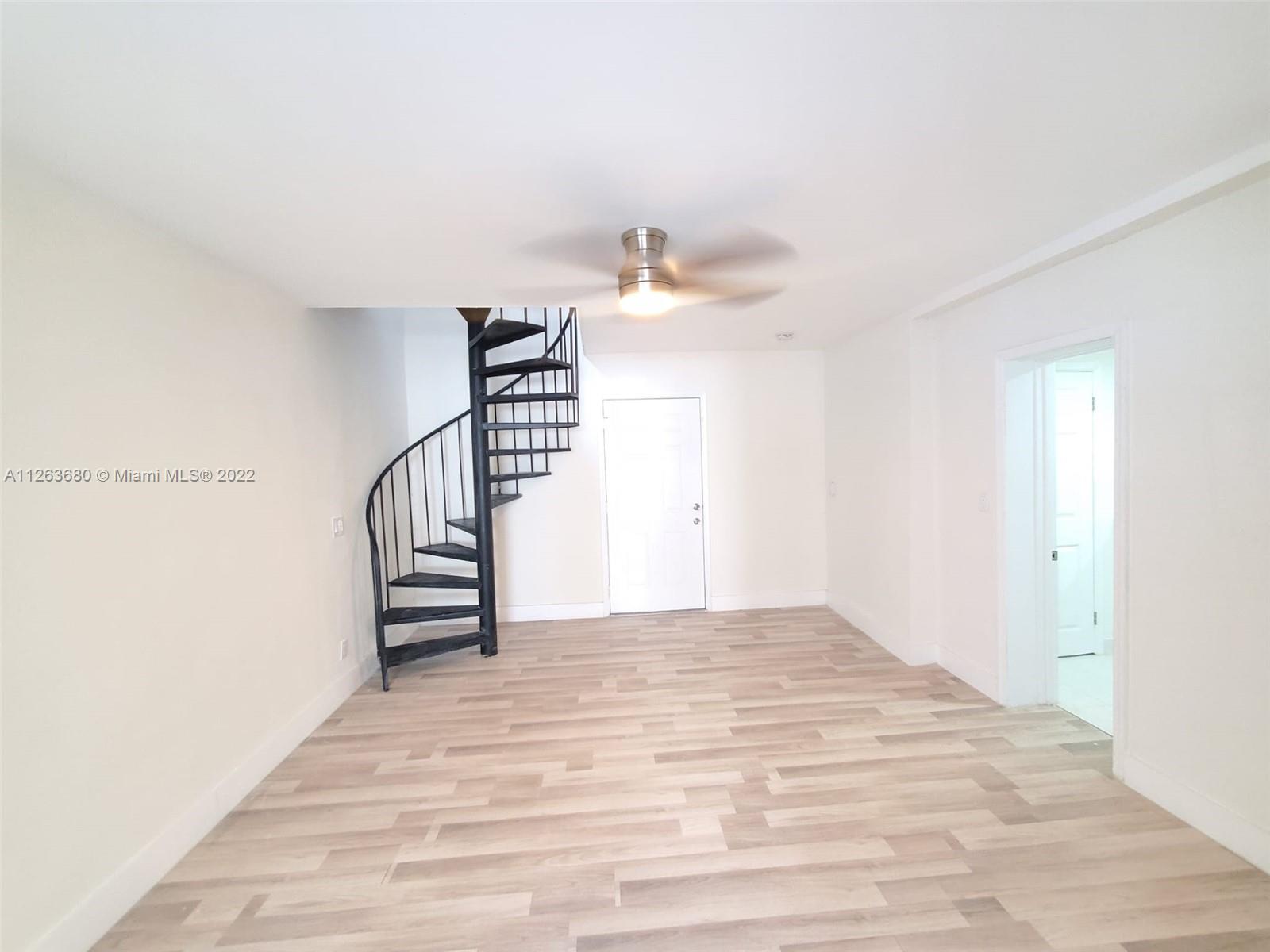 291 West 41st Street Hialeah, FL 33012 - Photo 8 of 40 a view of entryway and hall with wooden floor