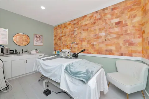 a white toilet sitting next to a bathroom sink