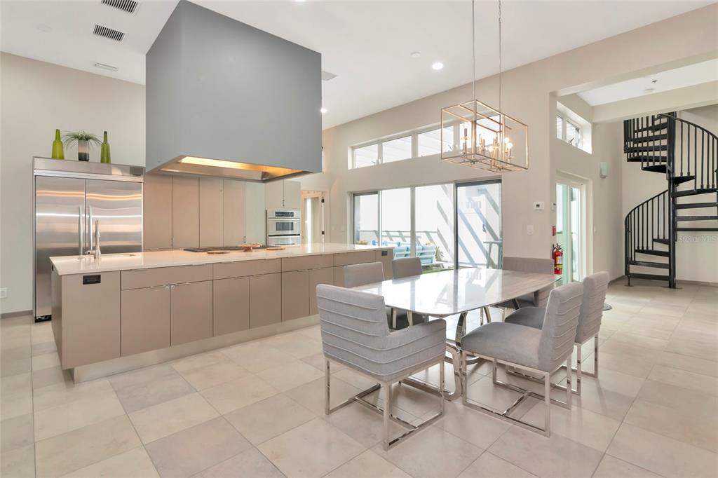 1345 2nd Street Sarasota, FL 34236 - Photo 61 of 98 a dining room with kitchen island furniture a large window and a sink