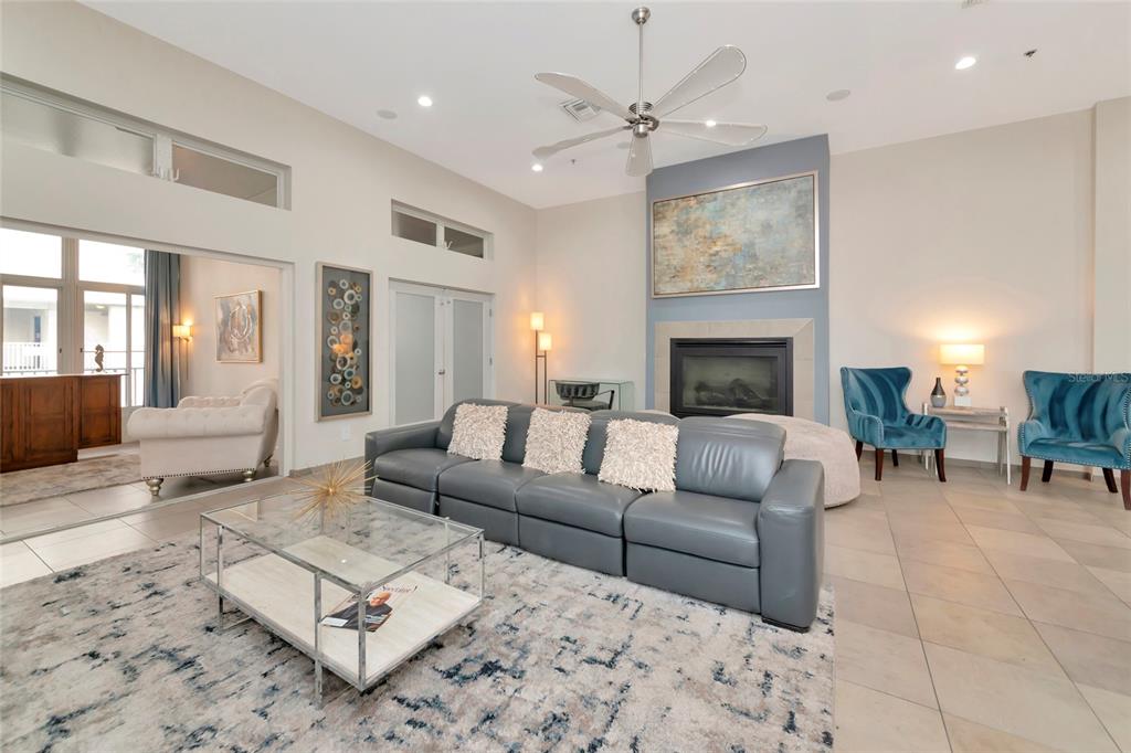 1345 2nd Street Sarasota, FL 34236 - Photo 63 of 98 a living room with furniture a fireplace and a chandelier