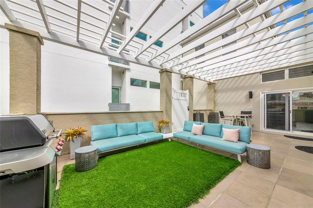 1345 2nd Street Sarasota, FL 34236 - Photo 77 of 98 a living room with furniture and a garden