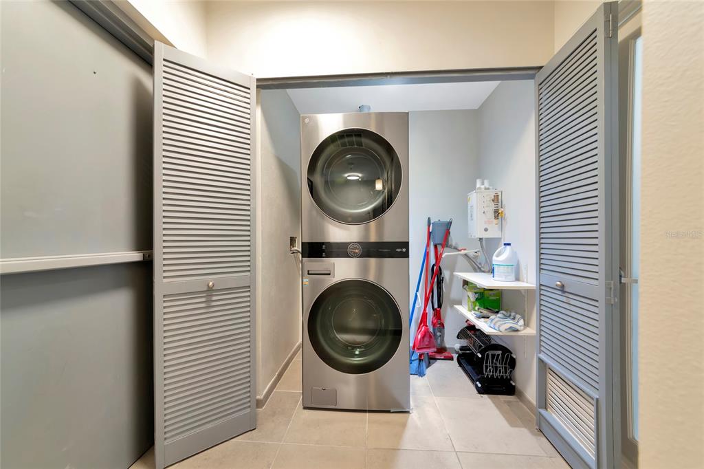 1345 2nd Street Sarasota, FL 34236 - Photo 90 of 98 a view of a bedroom with washer and dryer