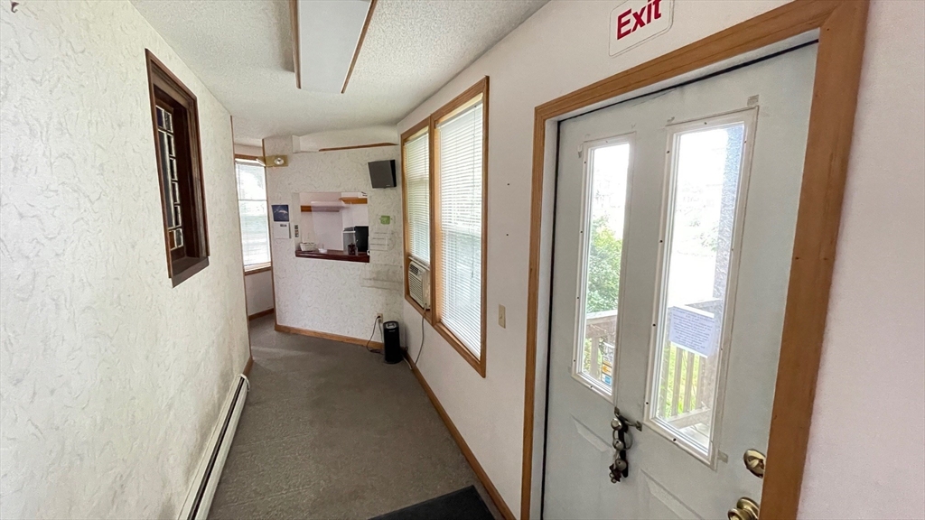 755 Grattan Street Chicopee, MA 01020 - Photo 12 of 39 a view of a hallway with a livingroom and furniture