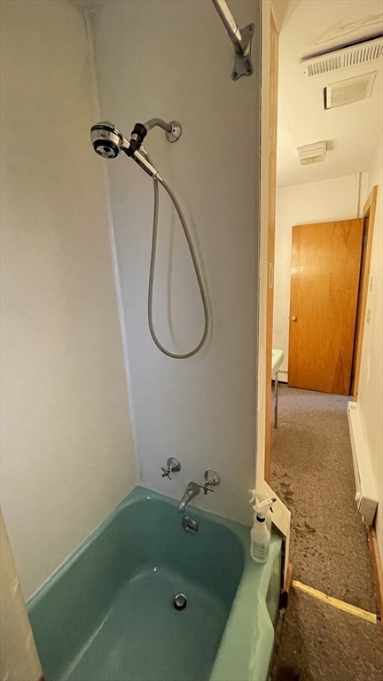 755 Grattan Street Chicopee, MA 01020 - Photo 17 of 39 a bathroom with a tub and a shower