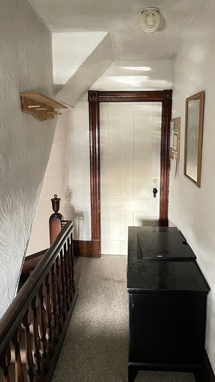 755 Grattan Street Chicopee, MA 01020 - Photo 39 of 39 a view of a hallway to a livingroom with furniture