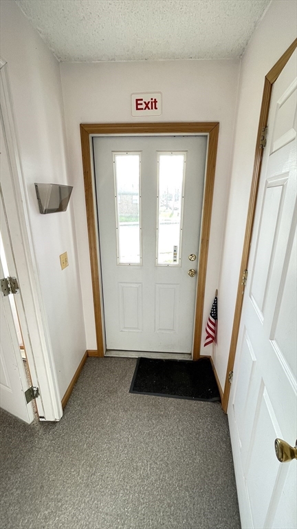 755 Grattan Street Chicopee, MA 01020 - Photo 4 of 39 a view of front door with stairs