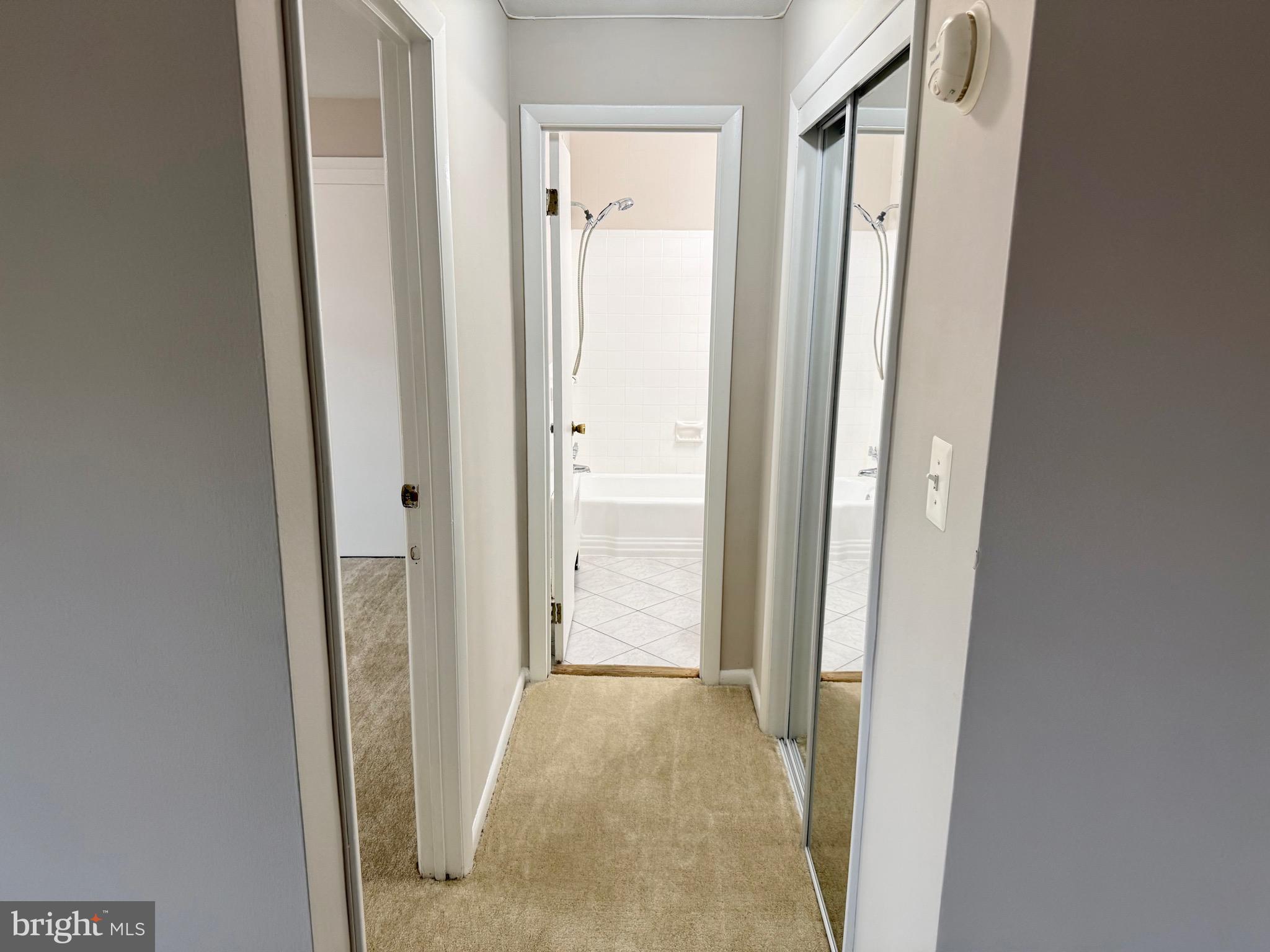 5111 8th Road South, Unit 203 Arlington, VA 22204 - Photo 16 of 31 a view of a bathroom from a hallway