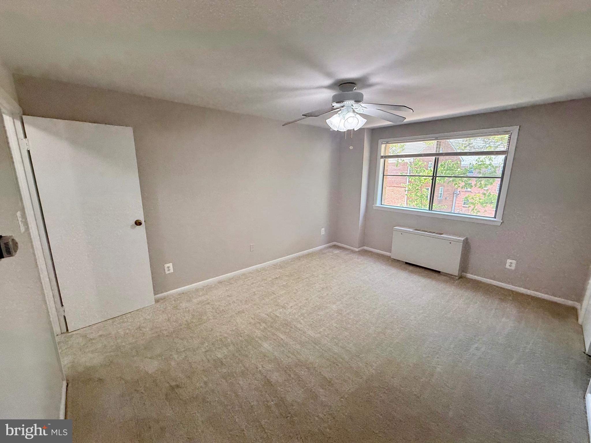 5111 8th Road South, Unit 203 Arlington, VA 22204 - Photo 18 of 31 an empty room with windows and fan
