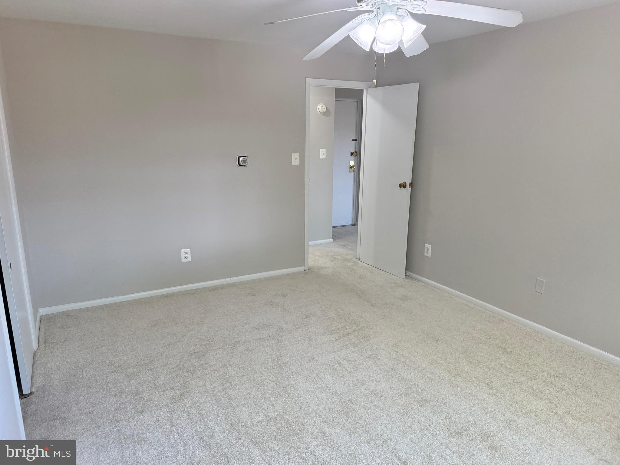 5111 8th Road South, Unit 203 Arlington, VA 22204 - Photo 20 of 31 a view of an empty room with a chandelier fan