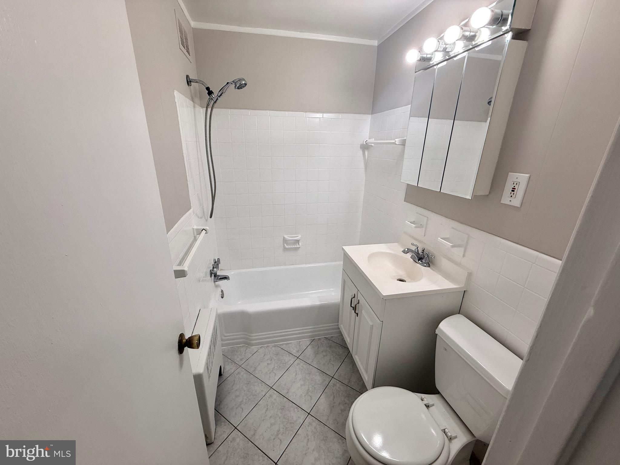 5111 8th Road South, Unit 203 Arlington, VA 22204 - Photo 21 of 31 a bathroom with a sink toilet and shower