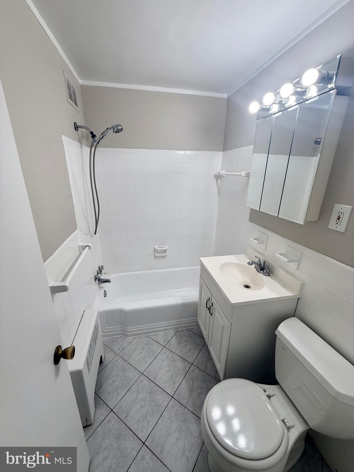 5111 8th Road South, Unit 203 Arlington, VA 22204 - Photo 23 of 31 a bathroom with a toilet sink and shower
