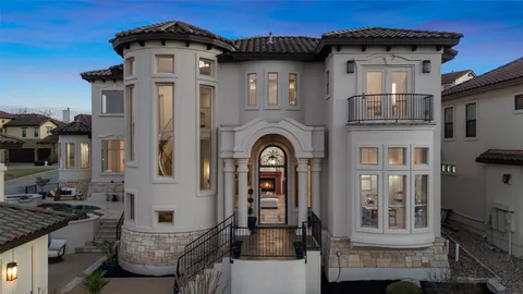 a front view of a house with many windows