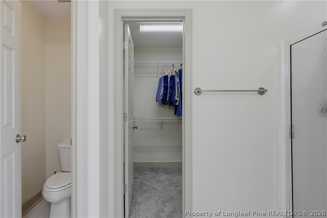 1075 Buffalo Lake Road Sanford, NC 27332 - Photo 28 of 49 a bathroom with a shower and a toilet
