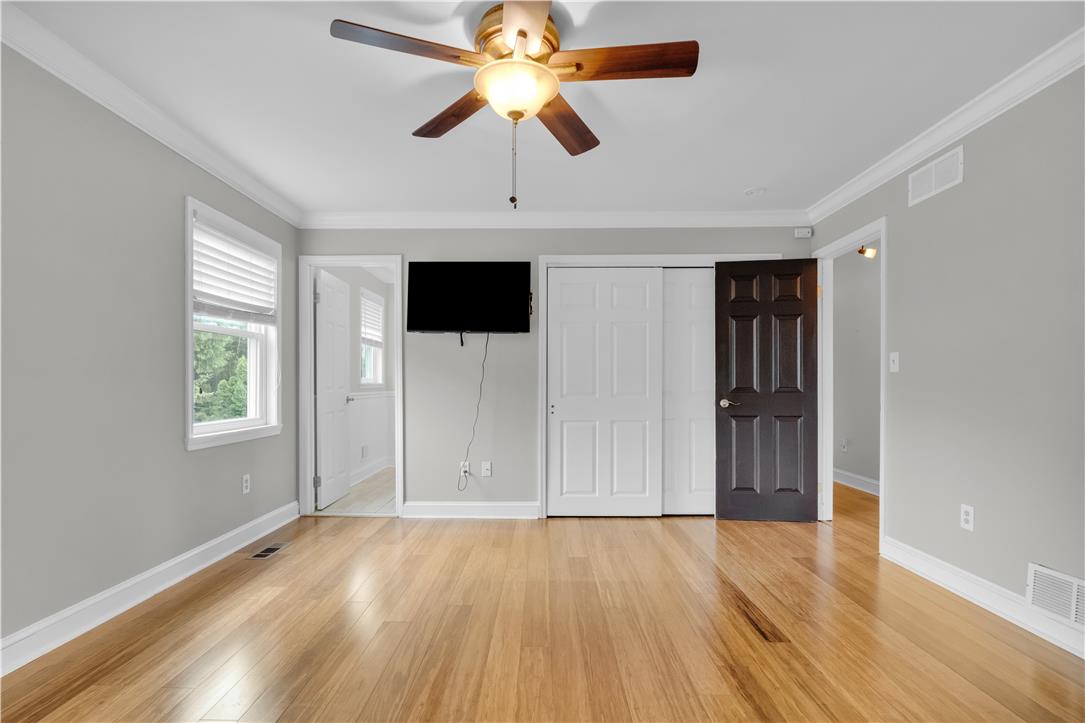 3396 Darien Road Bethlehem, PA 18020 - Photo 30 of 44 Bright hardwood floors and a warm ceiling fan create a comfortable atmosphere.