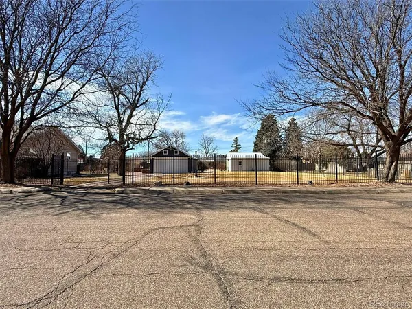 a view of road with snow on the house