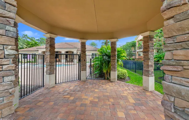 a view of a park with pathway in front of house