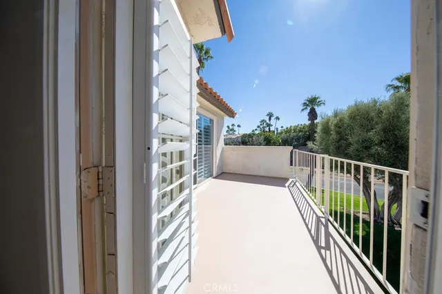 a view of balcony with furniture