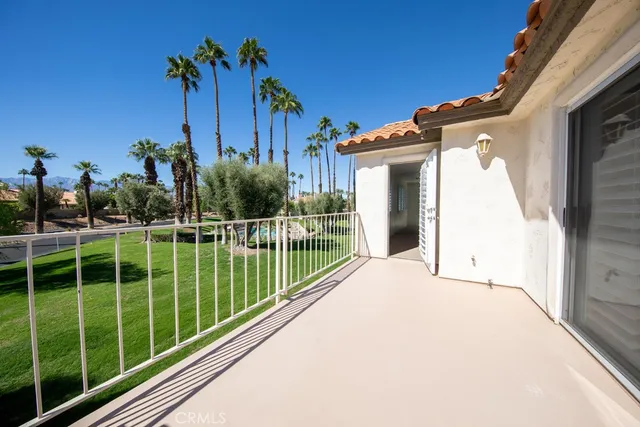 a view of a house with a garden and plants