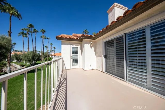 a porch with seating space and yard