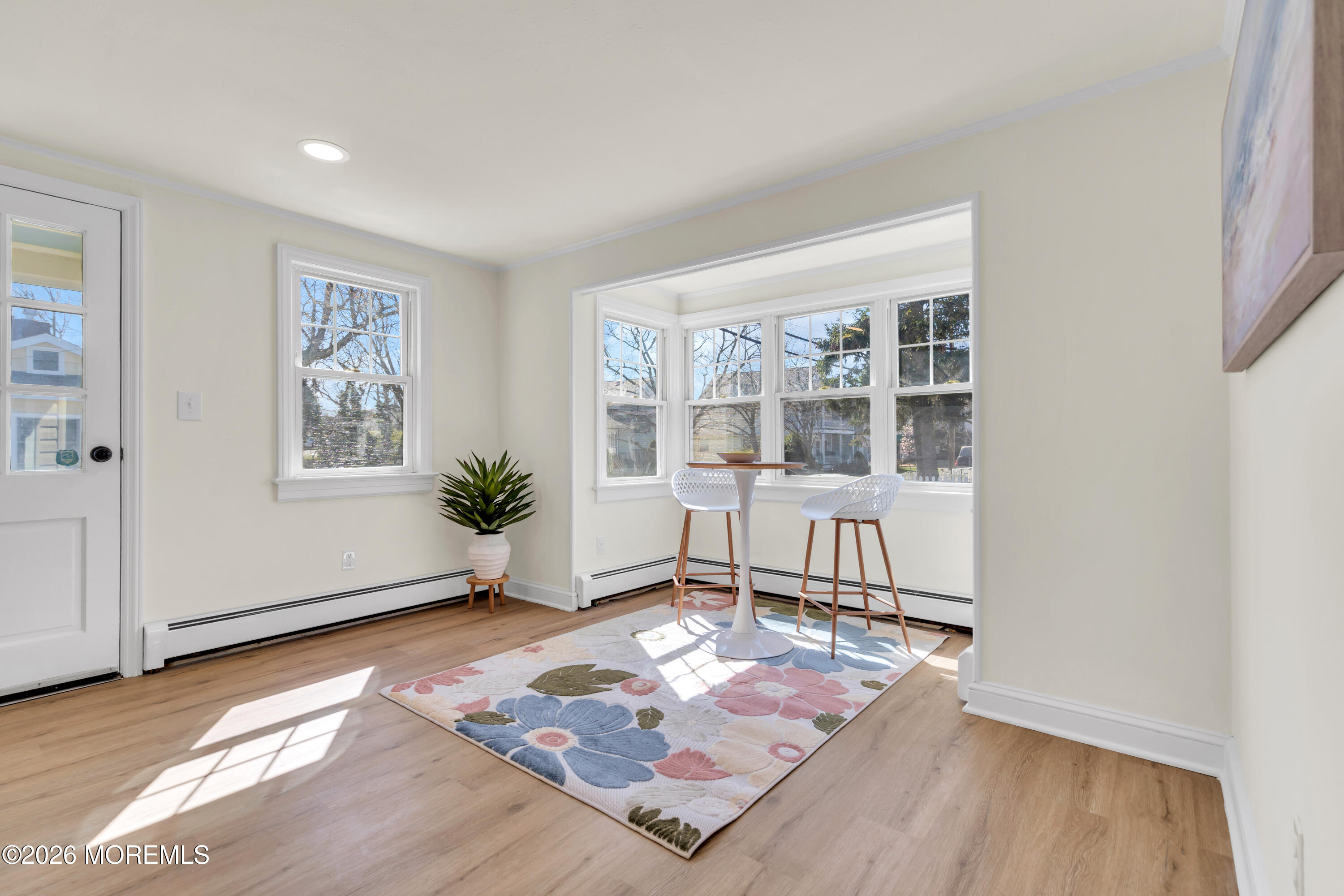 137 Inskip Avenue Ocean Grove, NJ 07756 - Photo 11 of 36 a living room with furniture and wooden floor