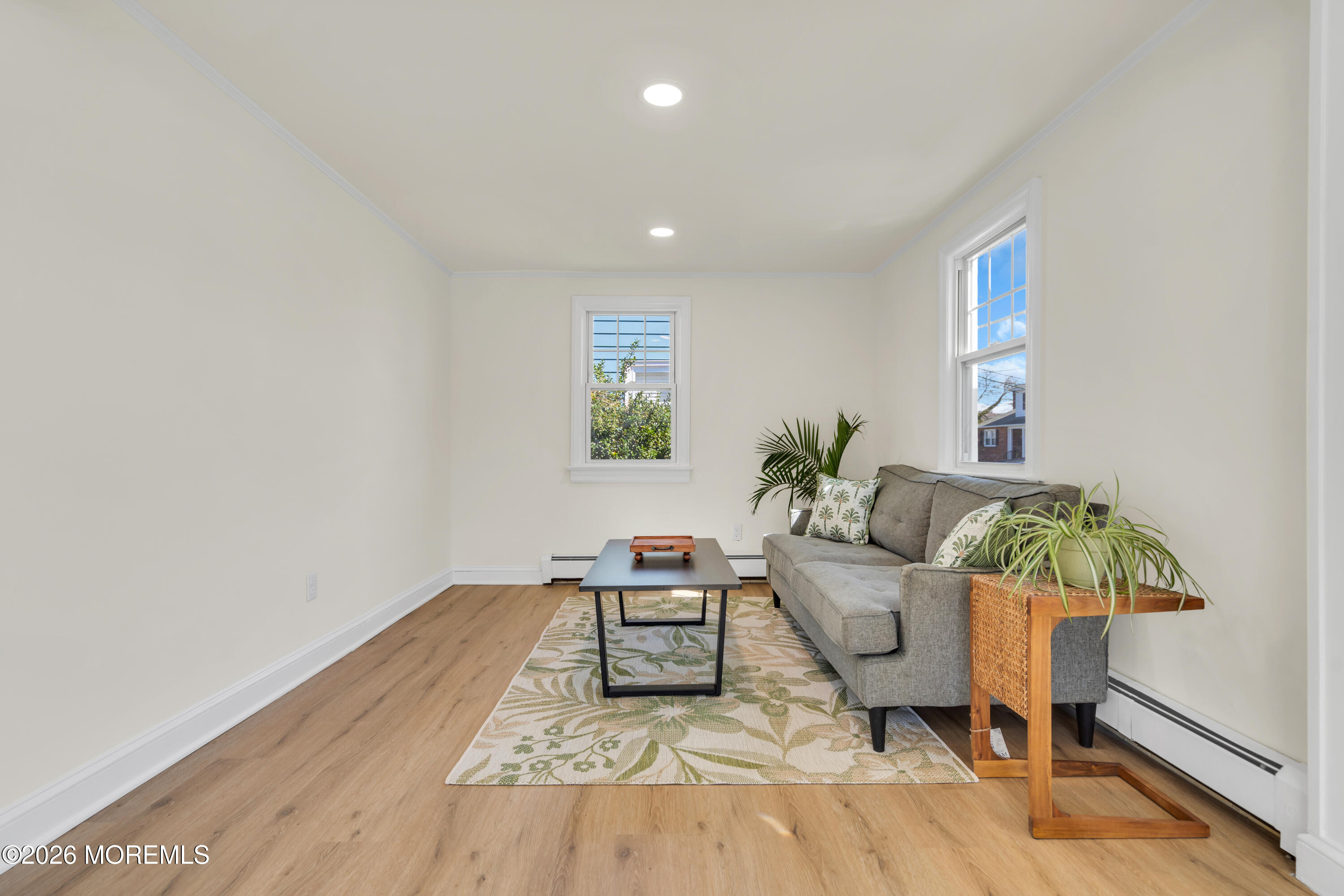 137 Inskip Avenue Ocean Grove, NJ 07756 - Photo 12 of 36 a living room with furniture and a potted plant