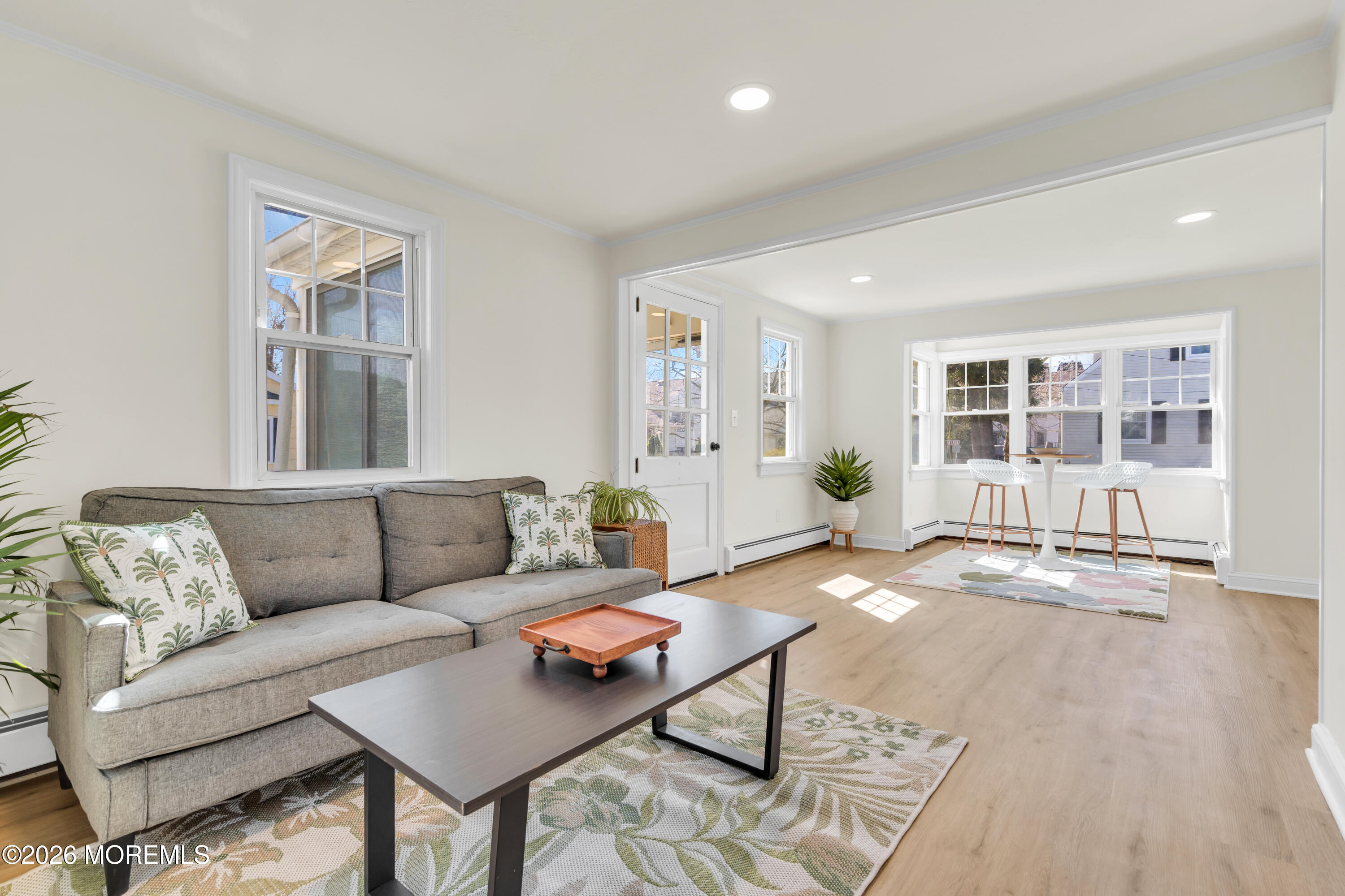 137 Inskip Avenue Ocean Grove, NJ 07756 - Photo 13 of 36 a living room with furniture and wooden floor