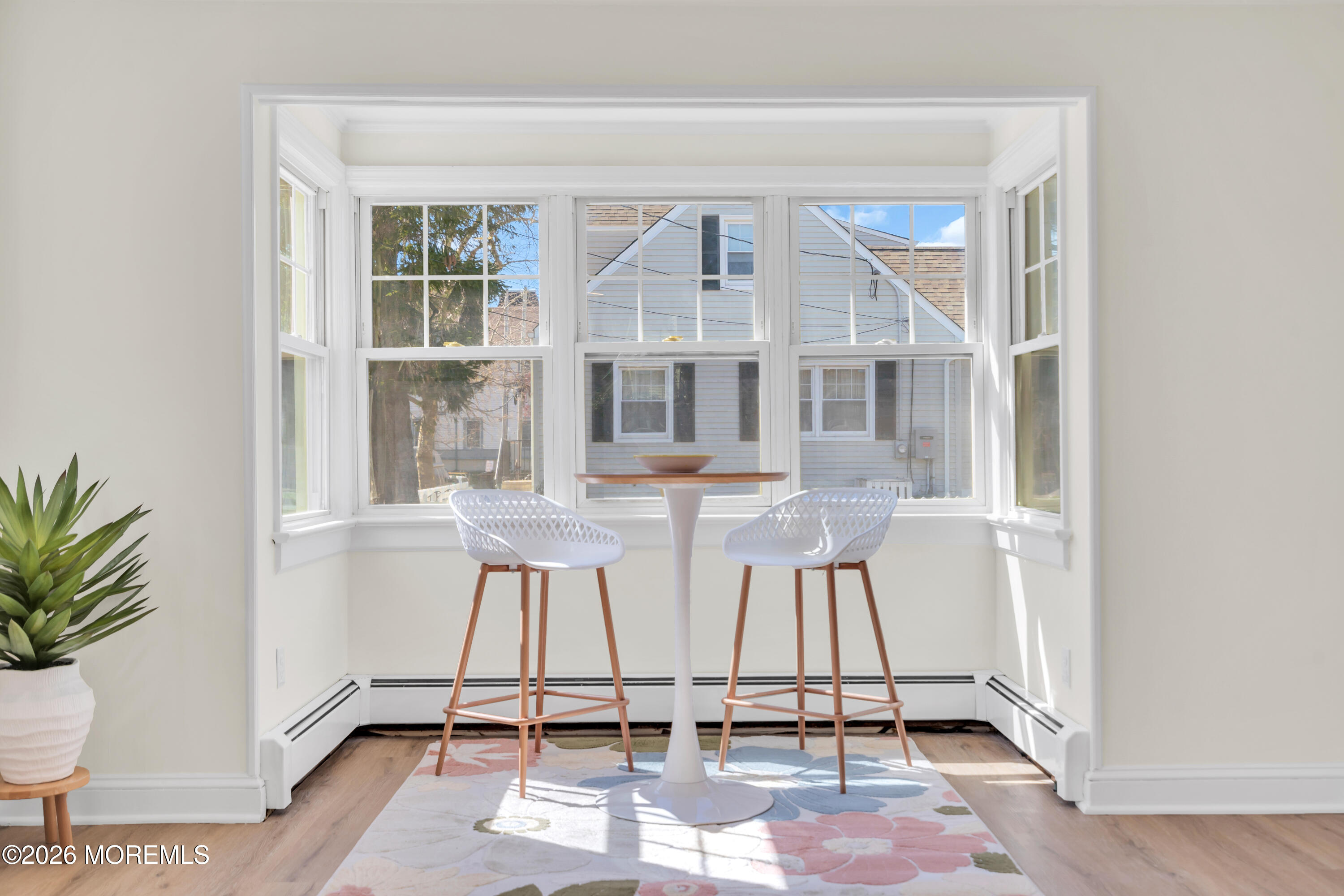 137 Inskip Avenue Ocean Grove, NJ 07756 - Photo 14 of 36 an entryway with a table and chairs