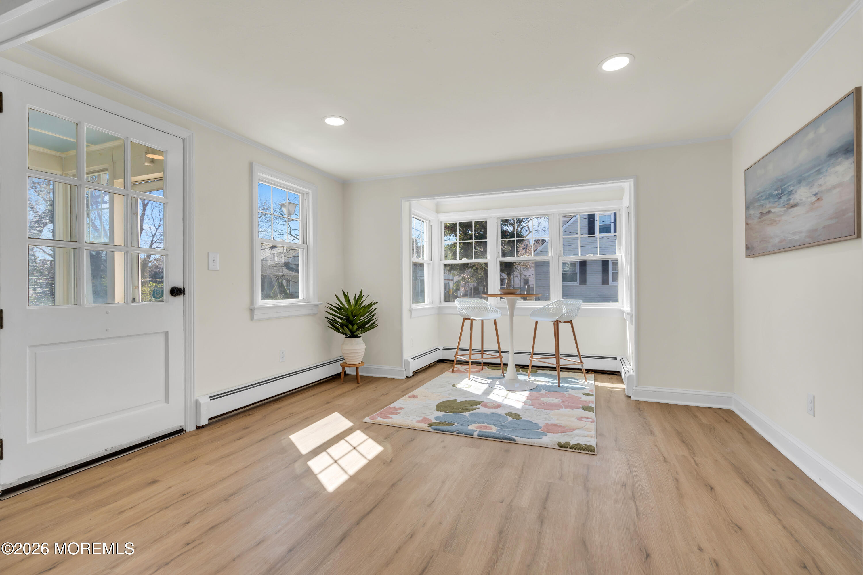 137 Inskip Avenue Ocean Grove, NJ 07756 - Photo 15 of 36 a view of empty room with a window and wooden floor