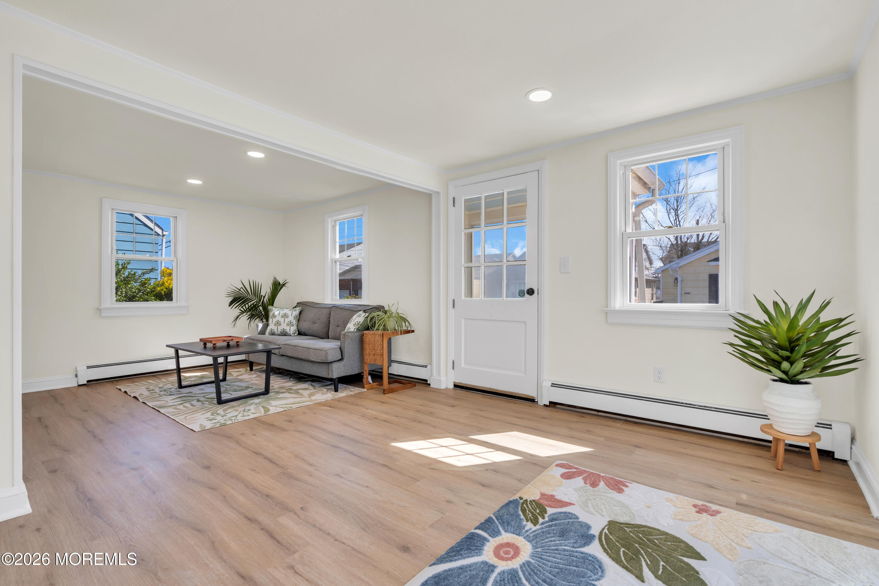 137 Inskip Avenue Ocean Grove, NJ 07756 - Photo 16 of 36 a living room with furniture and wooden floor