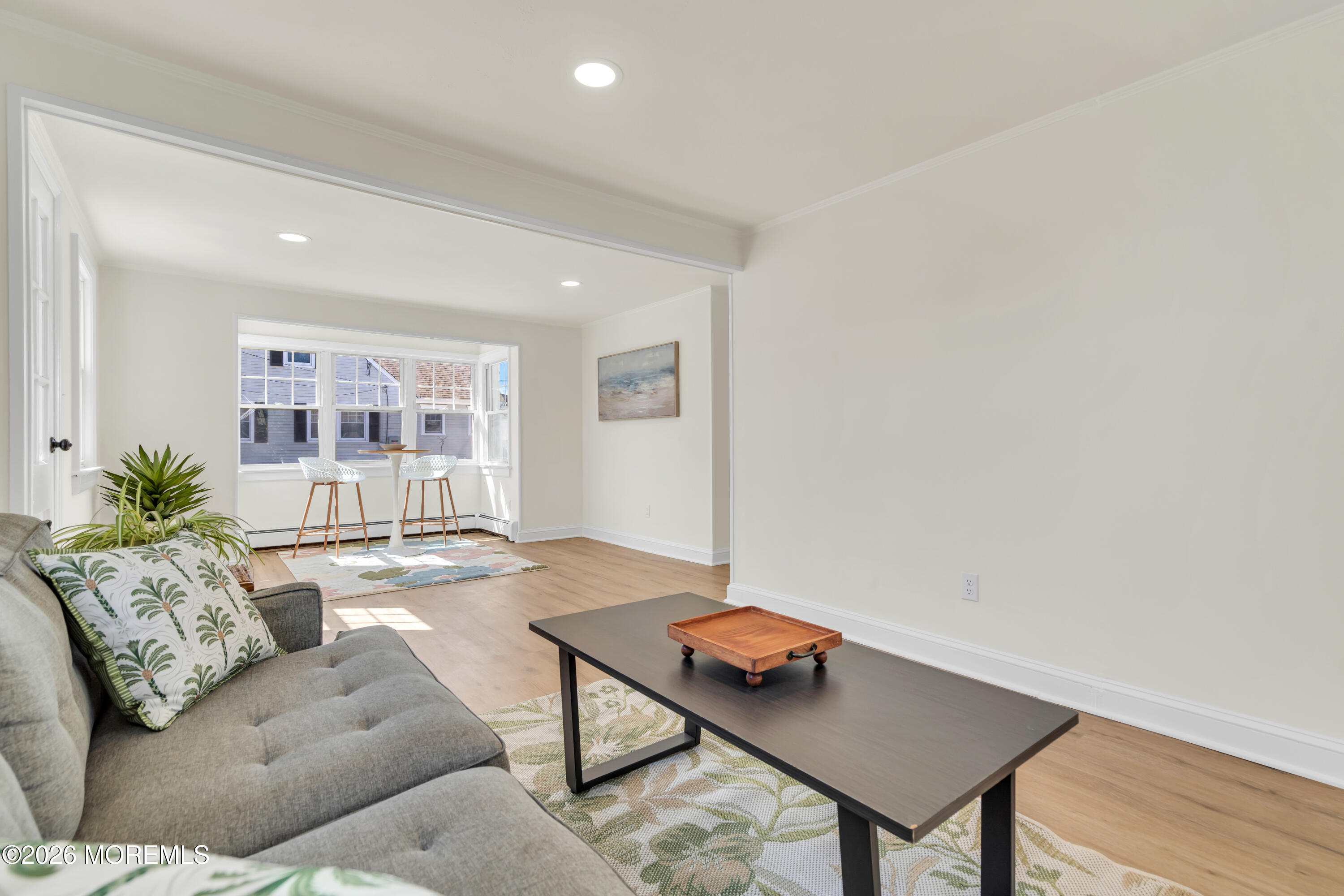 137 Inskip Avenue Ocean Grove, NJ 07756 - Photo 18 of 36 a living room with furniture and wooden floor