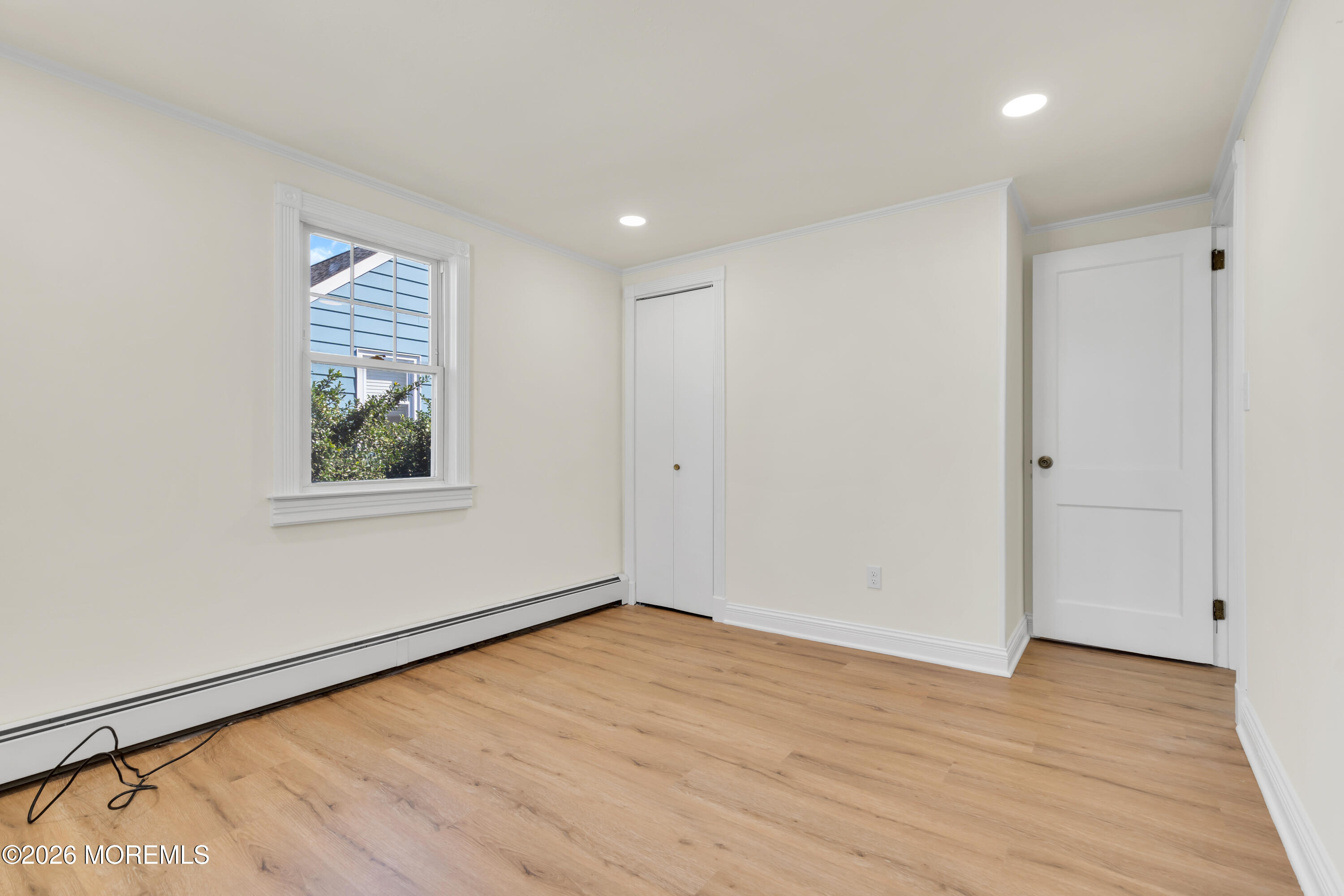 137 Inskip Avenue Ocean Grove, NJ 07756 - Photo 21 of 36 wooden floor in an empty room with a window