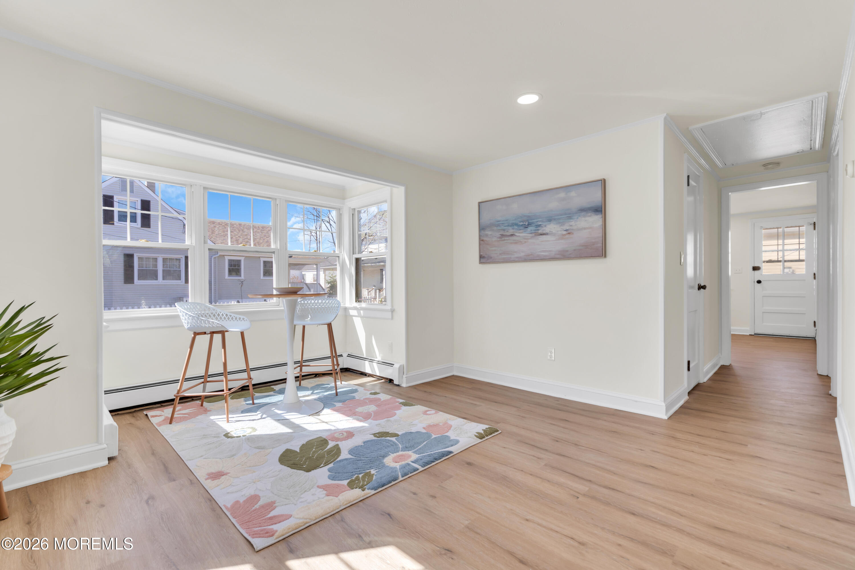 137 Inskip Avenue Ocean Grove, NJ 07756 - Photo 25 of 36 a living room with hard wood flooring and a rug